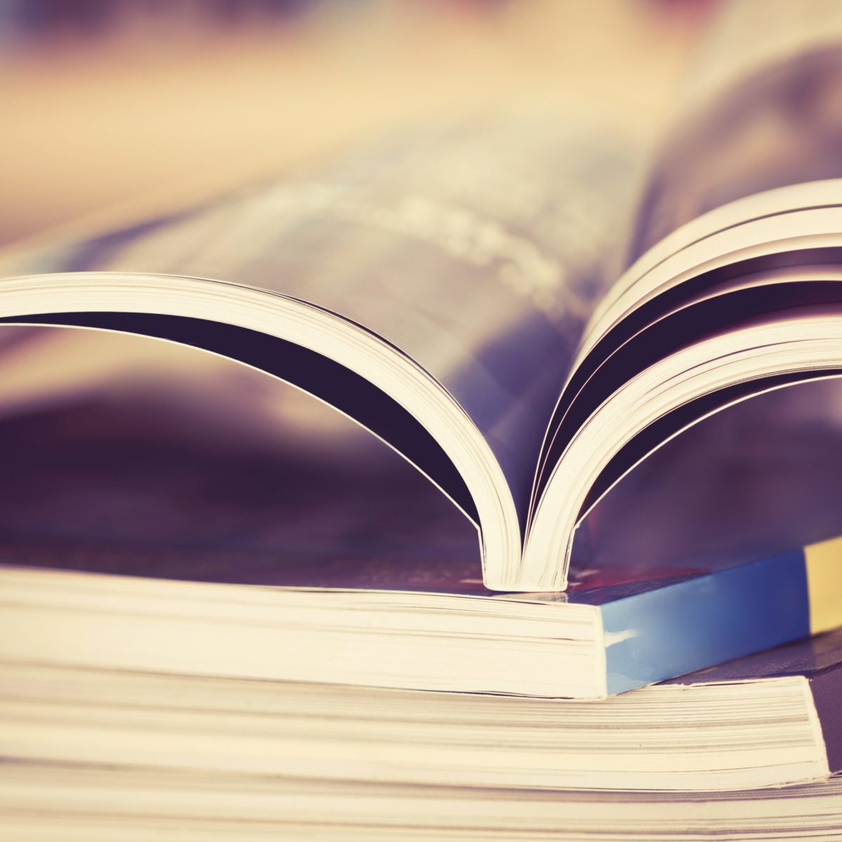 A book is opened with the pages visible from the side