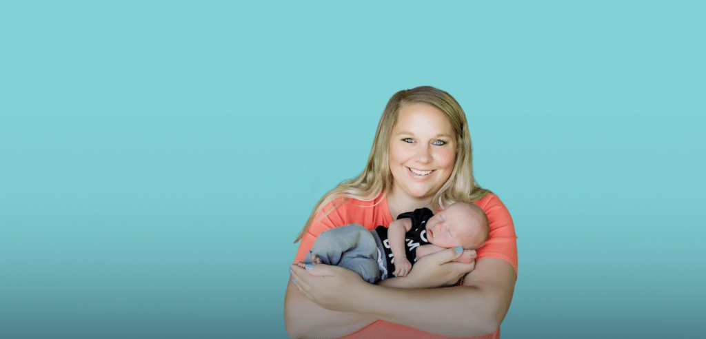 a woman holding an infant